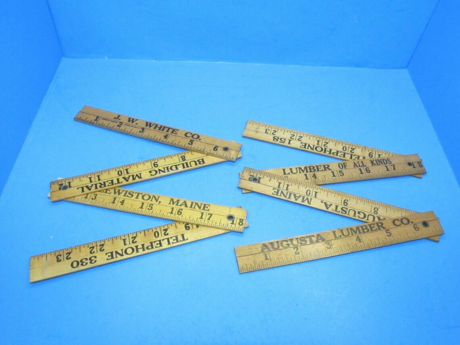 lot of 2 folding advertising rules rulers from Maine lumber yards 2 foot 4 fold